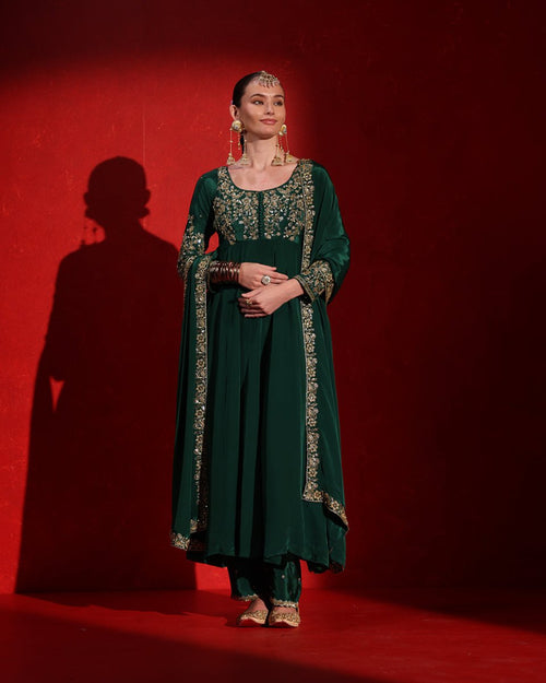 Deep Green Embellished Anarkali Suit by Agapi Clothing featuring ornate hand embellishments, a graceful flowing silhouette, and luxurious ethnic style for weddings and festive occasions.