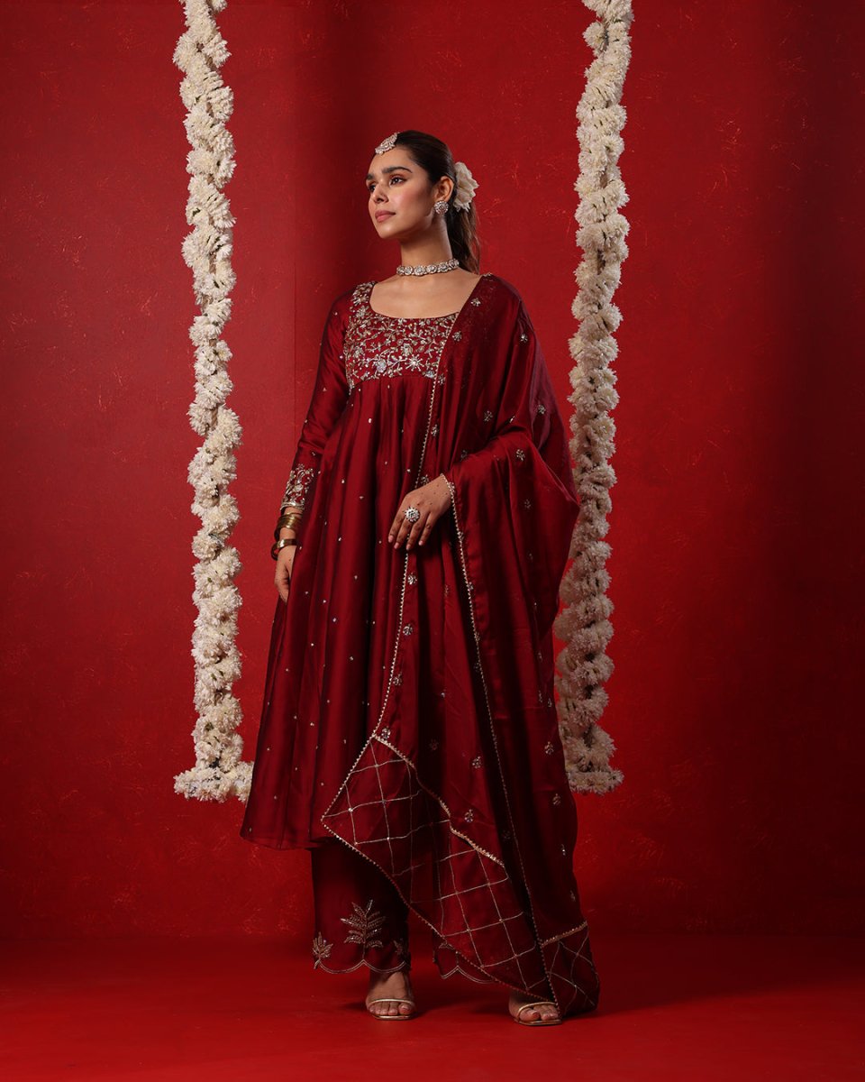 Maroon Embroidered Anarkali Suit by Agapi Clothing adorned with intricate ethnic detailing, crafted for elegant wedding functions, festive gatherings, and traditional celebrations.