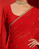Ruby Red Embellished Saree by Agapi Clothing featuring sparkling handcrafted embellishments, a luxurious festive drape, and elegant Indian designer wear for weddings and receptions.