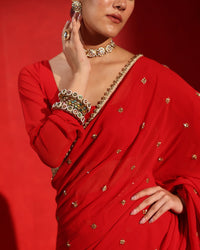 Ruby Red Embellished Saree by Agapi Clothing featuring sparkling handcrafted embellishments, a luxurious festive drape, and elegant Indian designer wear for weddings and receptions