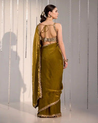 Green ethnic saree with zari and sequin detailing