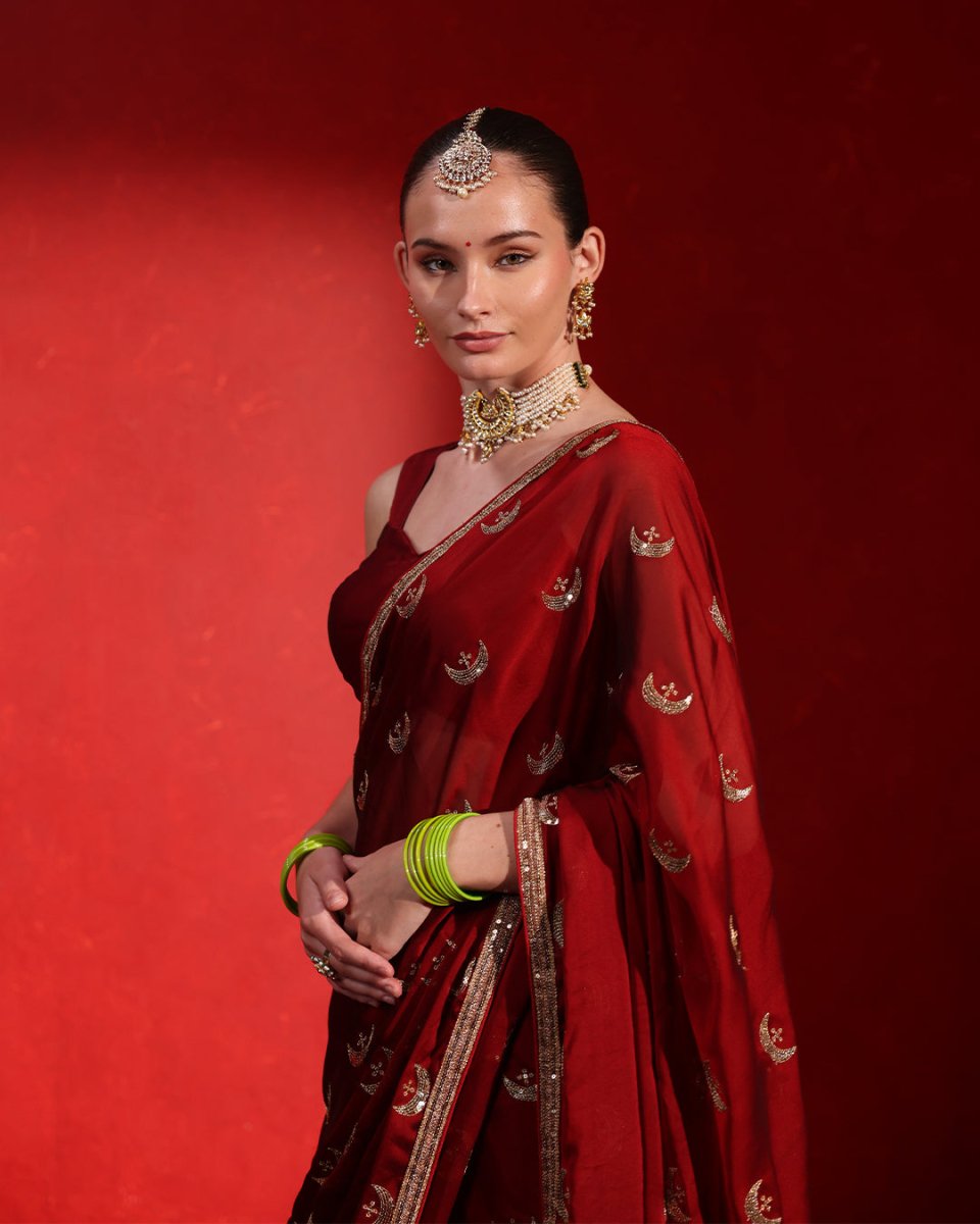 Chandrama Red Wine Heritage Saree by Agapi Clothing featuring heritage-inspired craftsmanship, a rich wine red palette, and elegant designer ethnic wear for wedding celebrations.