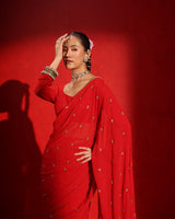 Ruby Red Embellished Saree by Agapi Clothing featuring sparkling handcrafted embellishments, a luxurious festive drape, and elegant Indian designer wear for weddings and receptions.